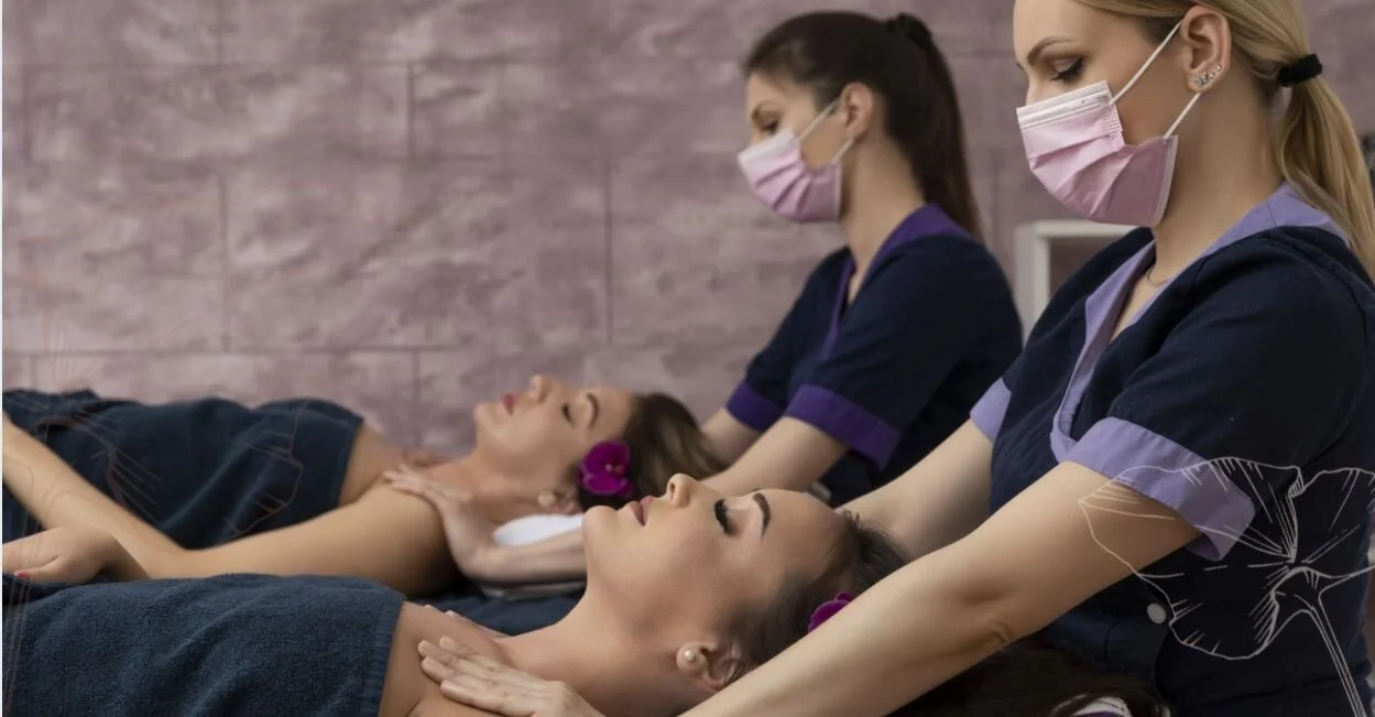 Students practicing massage techniques in class